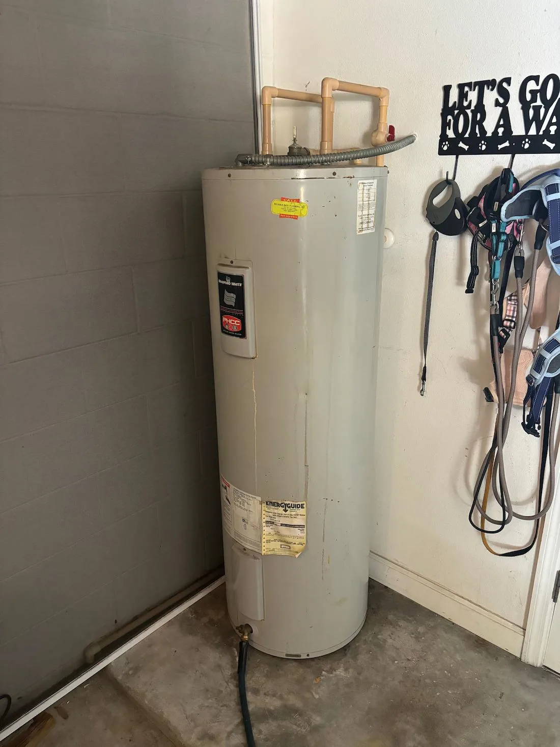Residential water heater installed in a garage