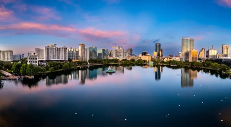 Downtown Orlando skyline reflected in Lake Eola at dusk